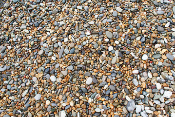 Stones by the sea, pebbles on the beach, sea coast.