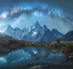 Acrylic prints Reflection Milky Way over snowy mountains and lake at night. Landscape with snow covered high rocks and starry sky reflected in water in Nepal. Sky with stars. amazing view with bright milky way in Himalayas