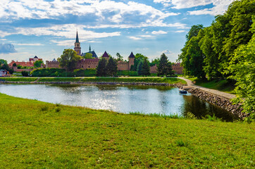 Fototapeta na wymiar Nymburk, medieval town fortification and church of Saint Giles, Czech republic - view from riverside