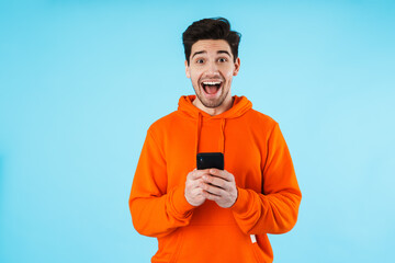 Portrait of a cheerful young man wearing hoodie - Powered by Adobe