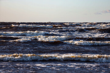 Beautiful sea landscape view of waves splashing on a windy day.