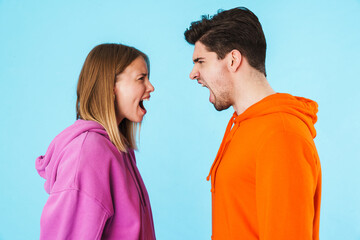 Fototapeta premium Portrait of a young couple wearing hoodies