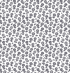 Floral pattern. Pretty flowers on white background. Printing with small black flowers. Ditsy print. Seamless vector texture. Spring bouquet.
