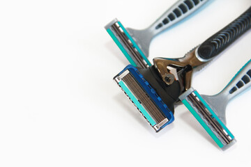 shaving machines with metal blades on a white background