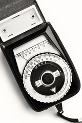 Old vintage photo exposure meter isolated