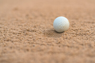 Golfer hit Golf ball on sand trap bunker at golf courses