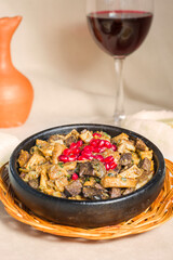 Kuchmachi, Georgian traditional food with meat, walnuts, pomegranates and onion.