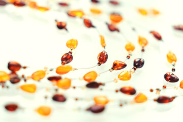 Amber necklace on a light background. beautiful background