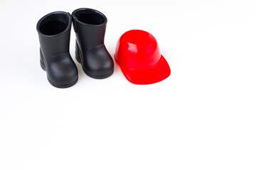 black boots and a red helmet on a white background