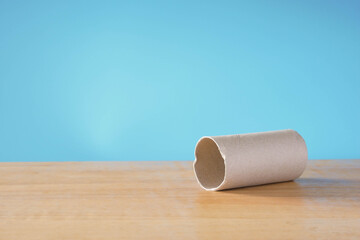 roll of toilet paper on blue background