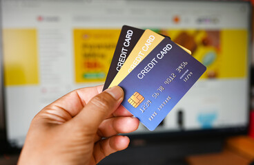 Credit card close up shot In hand concept of online shopping