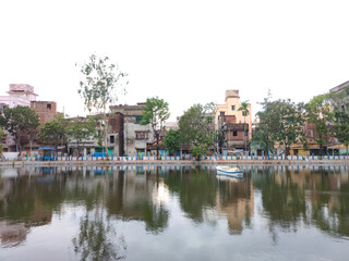 Fototapeta na wymiar A beautiful fresh pond into the local area in city