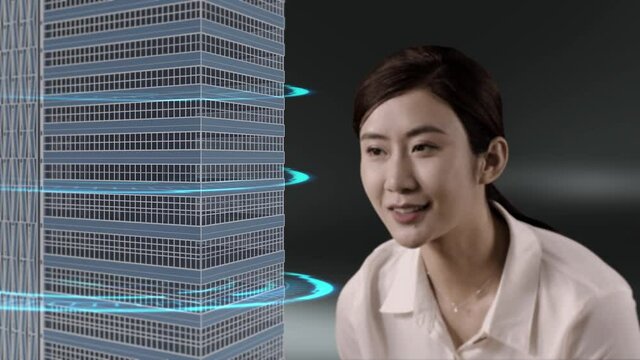 Asian female engineer using BIM model in virtual world