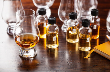 tasting bottles and glasses of whisky spirit brandy cognac. tasting at home