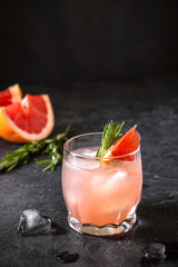 Pink Grapefruit Cocktail Spritze With Rosemary And Melting Ice