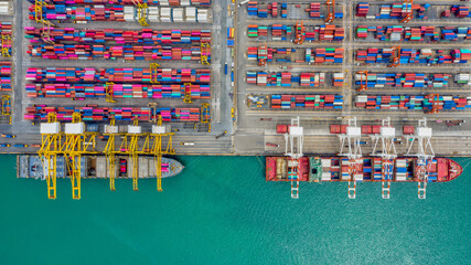 Fototapeta na wymiar Aerial view by drone container ship and boat going to sea port for logistics shipping