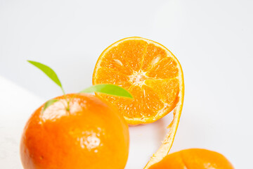 Orange mandarin or tangerine fruit skin textures . Juicy Orange in a orange peeled isolated on white background