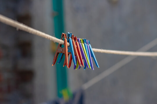 Colorful clothespin cloth peg set hanging on the rope