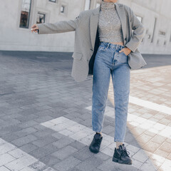 Street style of stylish fashion outfit in details outdoors. Close-up photo, of young fashion model...