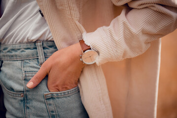 Stylish fashion white watch on woman hand.