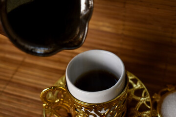 hot coffee poured into a cup