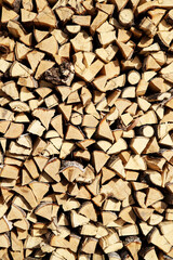 Firewood in a woodpile background. Preparation wood for the winter