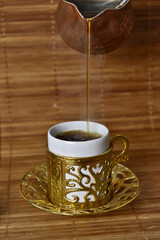 hot coffee poured into a cup