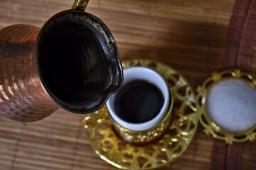 hot coffee poured into a cup