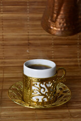 hot coffee poured into a cup