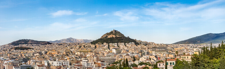 Fototapeta na wymiar Panoramic view of the Lycabettus Hill from the Areopagus hill, Athens, Greece.