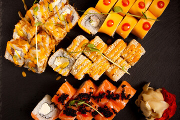 Japanese food: Set of salmon sushi and rolls with salmon and eel