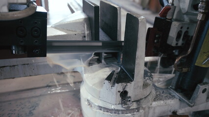 Automatic saw to saw a metal pipe. Automatic Band Saw