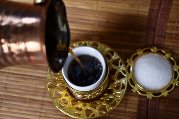 hot coffee poured into a cup