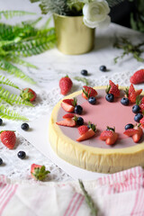 Low Fat Mousse Yogurt Strawberry and Raspberry Cheesecake set on cafe table.  Gluten Free Low-Carb Healthy Dessert.
