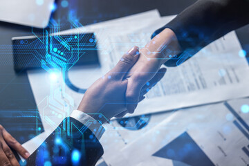 Double exposure of two businesspeople handshake and binary technology hologram drawing background. Concept of partnership and agreement. Formal wear.