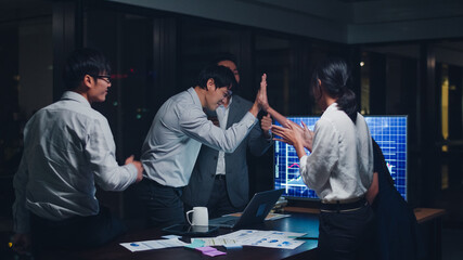 Millennial group of young businesspeople Asia businessman and businesswoman celebrate giving five...
