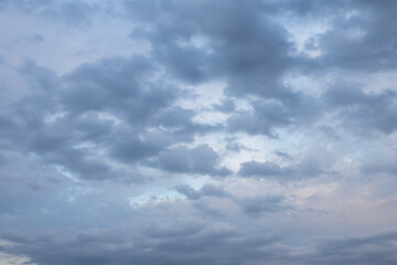 The background texture and dramatic sky with low clouds