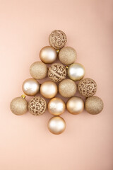 composition of Christmas toys of gold and red, paper background, Christmas tree