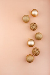 Fototapeta premium composition of gold and red Christmas toys, paper background