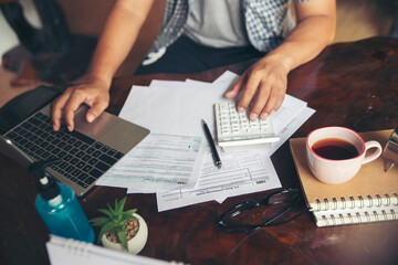 Budget planning concept, Accountant calculating tax and using mobile phone,  work online at home. Calendar 2019 and personal annual tax forms for individual income under US law placed on office desk. - obrazy, fototapety, plakaty