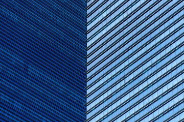 Obraz premium High glass skyscrapers on the streets of Singapore. Office windows background, closeup
