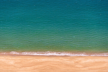 Aerial view of a sandy beach with blue sea water in the resort town of Nha Trang Vietnam