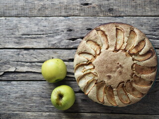 Homemade cake.Sponge Apple pie on a wooden table.