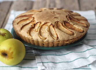 Homemade cake.Sponge Apple pie on a wooden table.