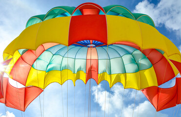 Freedom Summer holiday background of colorful parachute with bright blue sky and sunlight background