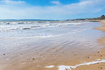 Fototapeta premium Sandy Bournemouth beach in spring, view of the blue sea, selective focus