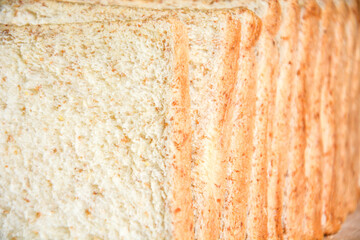 Closed up texture of fresh baked fluffy soft whole grain sliced breads