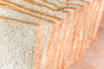 Closed up texture of fresh baked fluffy soft whole grain sliced breads