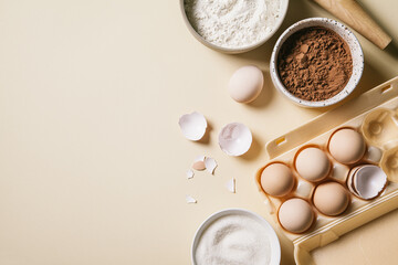 Rolling pin and baking ingredients. Flour, eggs, sugar, and cocoa powder.