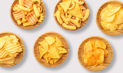 Crisps in a wooden bowl on a white background
